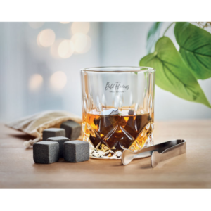 Whisky gift box with logo INVERNESS Luxury glass set in bamboo gift box for whiskey, gin, mojito or otherdrinks. Includes 2 glasses (300ml), 8 reusable stone ice cubes with storage cotton pouch and tongs. Bamboo is anatural product, there may beslight variations in colour and size per item, which can affect the finaldecoration outcome. Magnus Business Gifts is your partner for merchandising, gadgets or unique business gifts since 1967. Certified with Ecovadis gold!