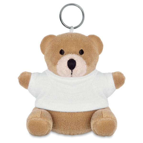 Key ring with logo Teddy bear NIL Teddy bear plush key ring. 100% cotton t-shirt for logo imprint. Available color: Blue, Red, White Dimensions: 5X9 CMWidth: 9 cmLength: 5 cmVolume: 0.262 cdm3Gross Weight: 0.021 kgNet Weight: 0.018 kg Magnus Business Gifts is your partner for merchandising, gadgets or unique business gifts since 1967. Certified with Ecovadis gold!